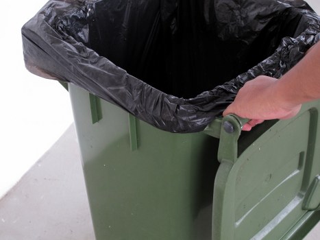 Waste clearance truck removing debris in North London